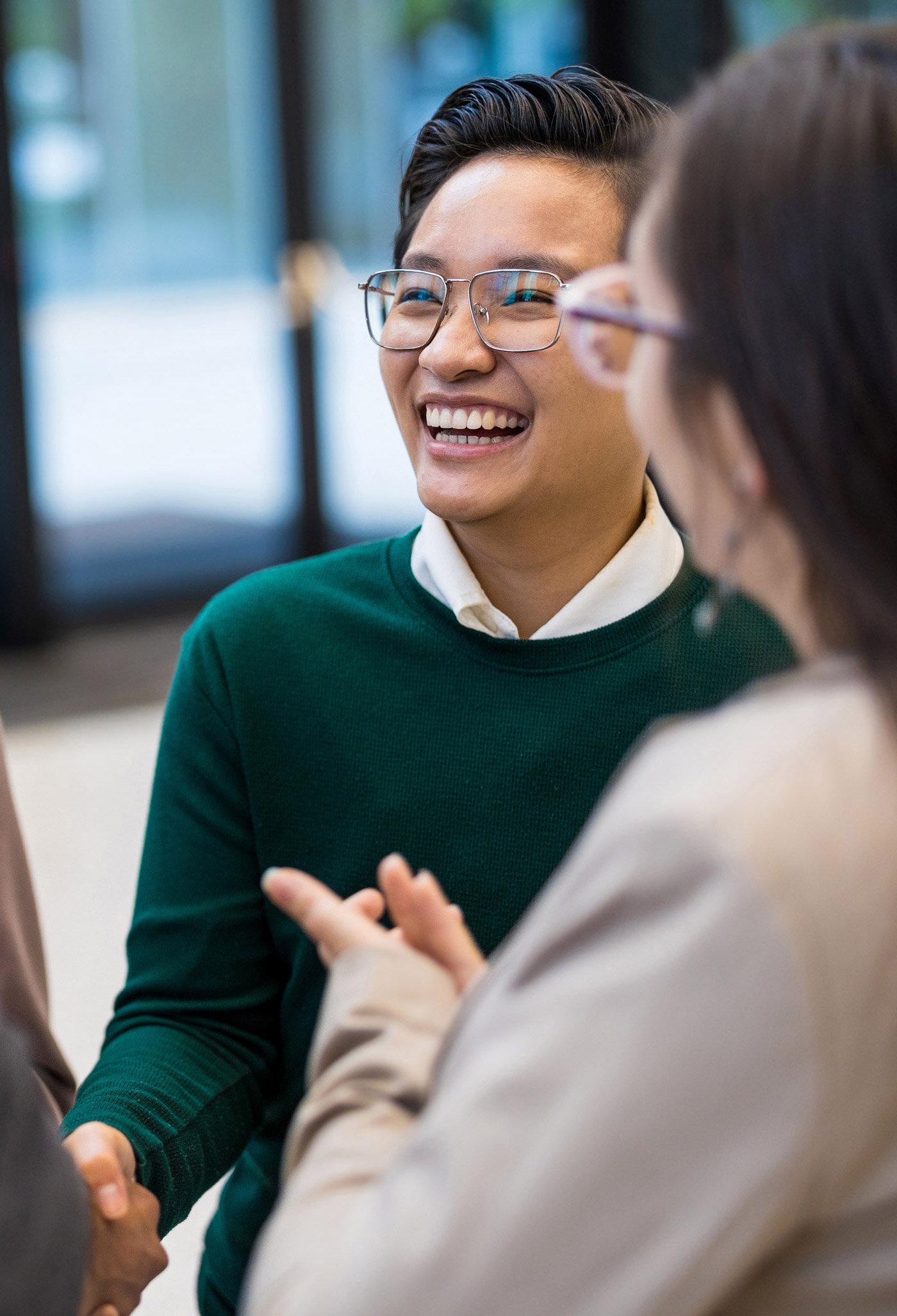 A group of potential employee talent stand talking in a circle