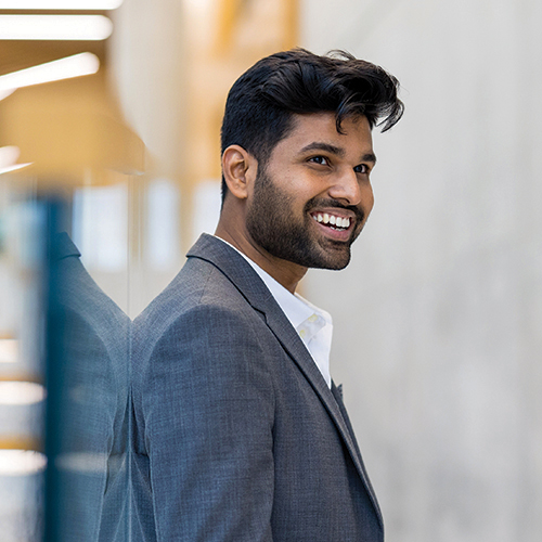 A smiling employee at a conference