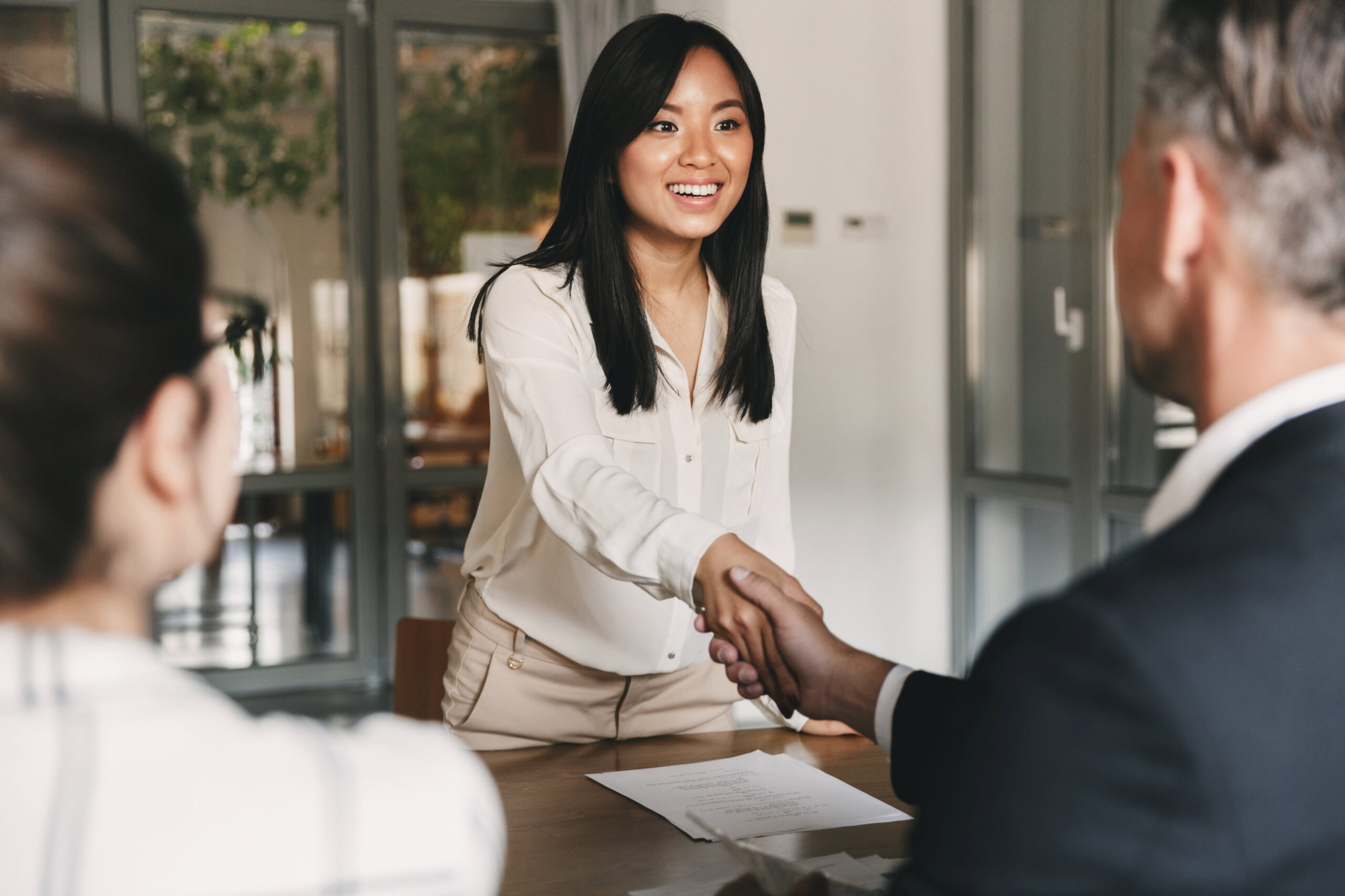 A future employee shakes hands with a future employer